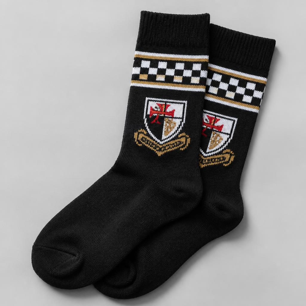 Black jacquard school socks with a gold checkerboard band and knitted crest